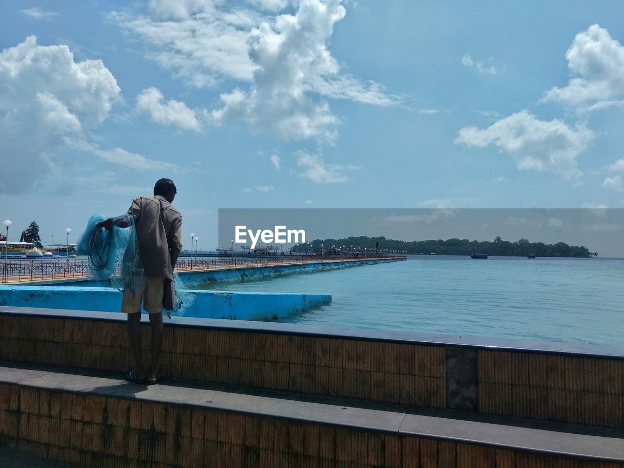 Man standing on waterfront