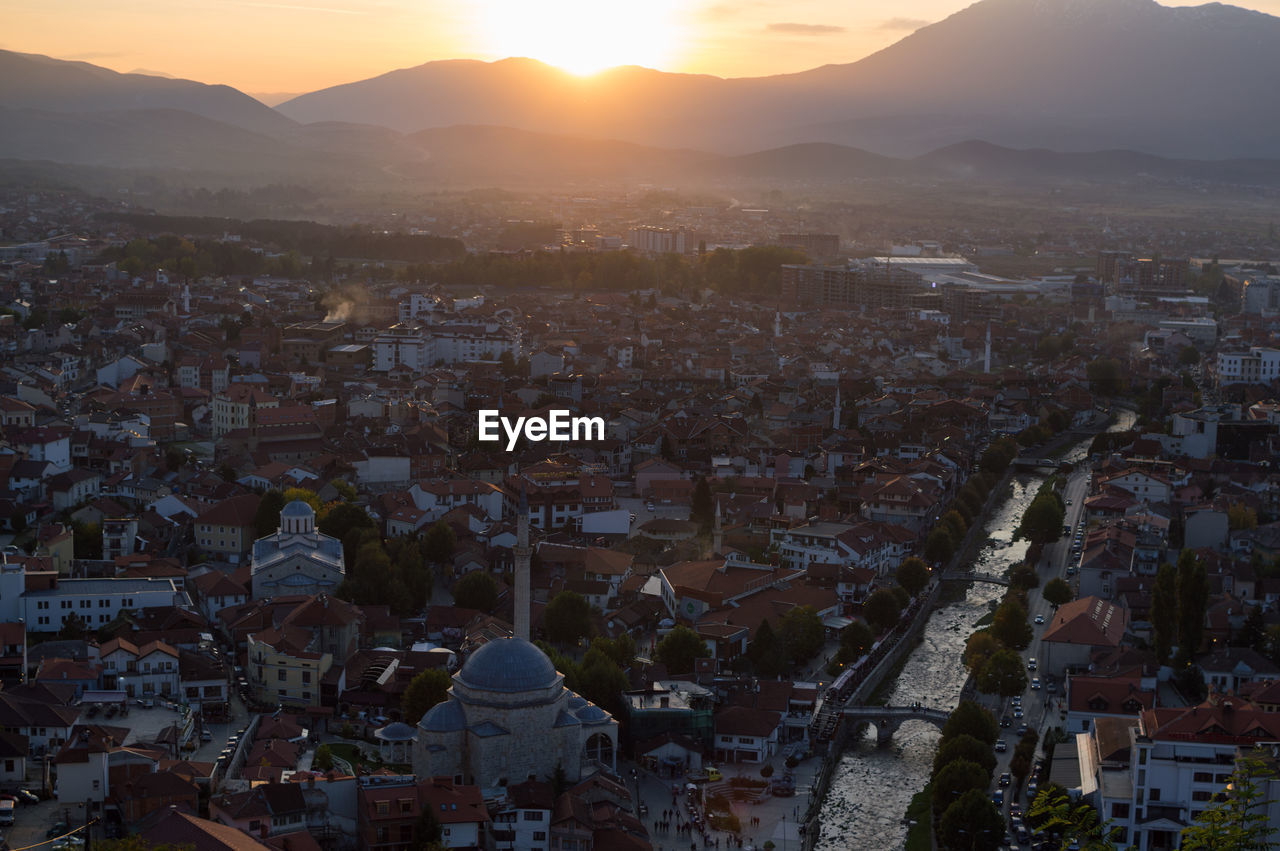 CITYSCAPE AGAINST SKY DURING SUNSET