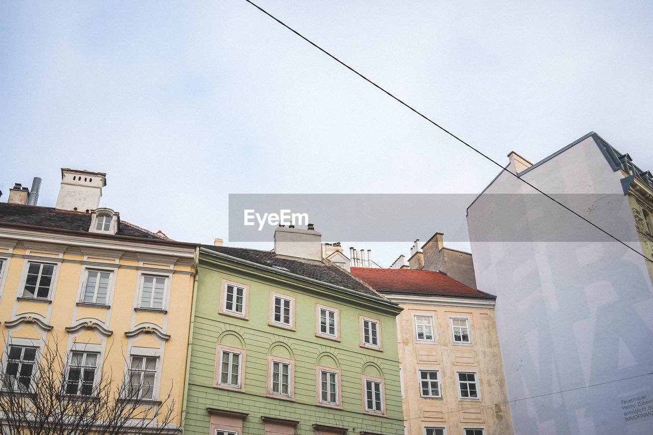 Low angle view of buildings against sky in city