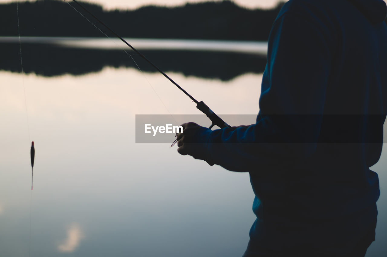 Man fishing in lake