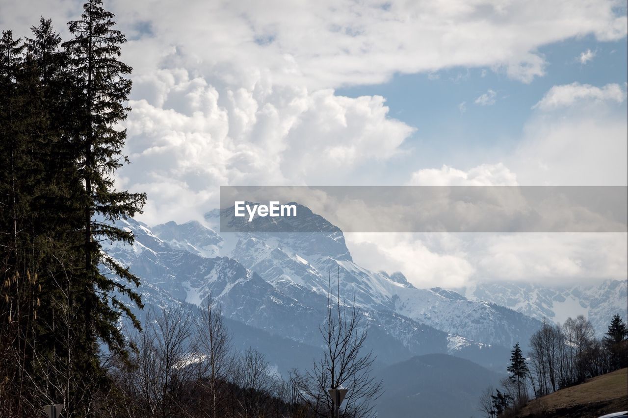 Scenic view of mountains against cloudy sky