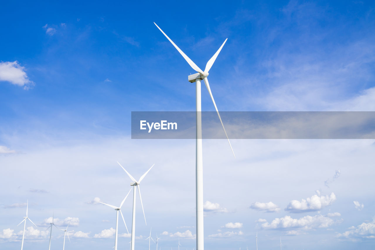 The wind turbines used to generate electricity provide clean energy to the earth on clear days.
