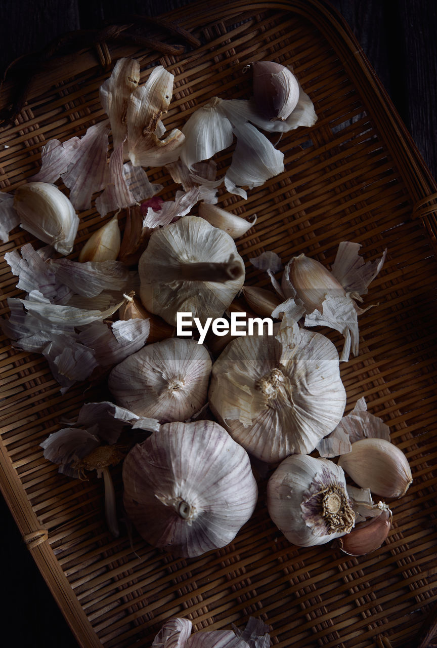 High angle view of garlic basket on table