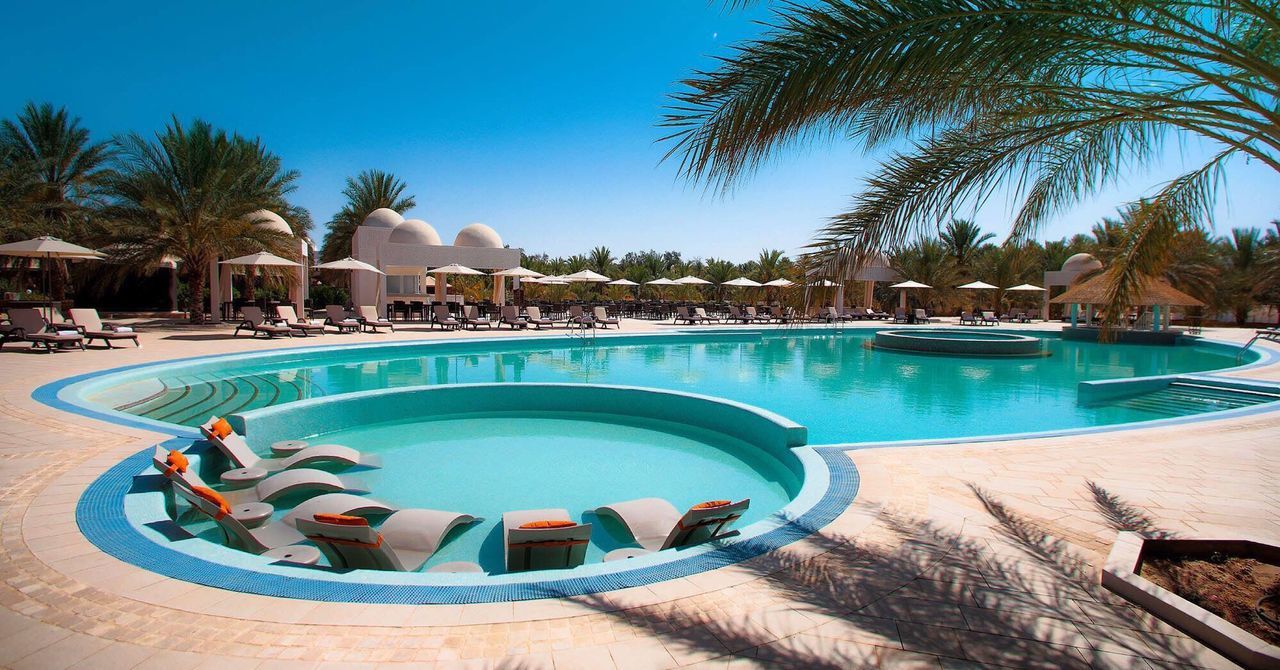 SWIMMING POOL AGAINST BLUE SKY