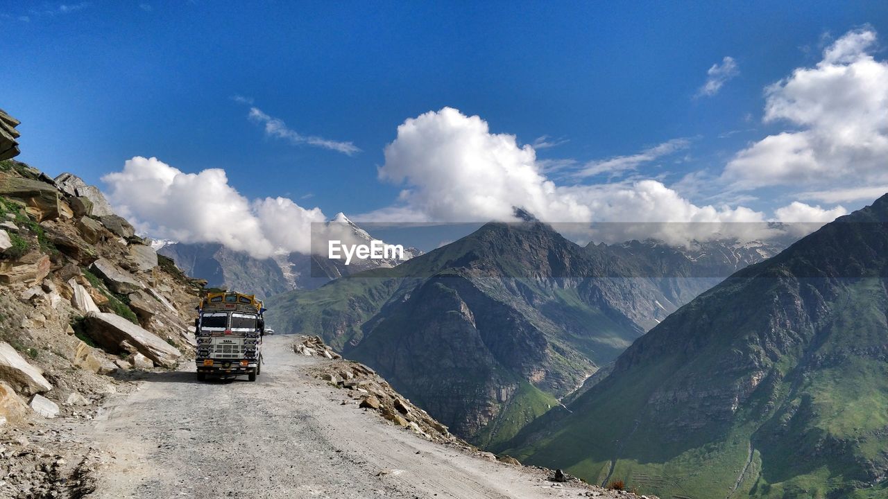 PANORAMIC VIEW OF SNOWCAPPED MOUNTAINS AGAINST SKY