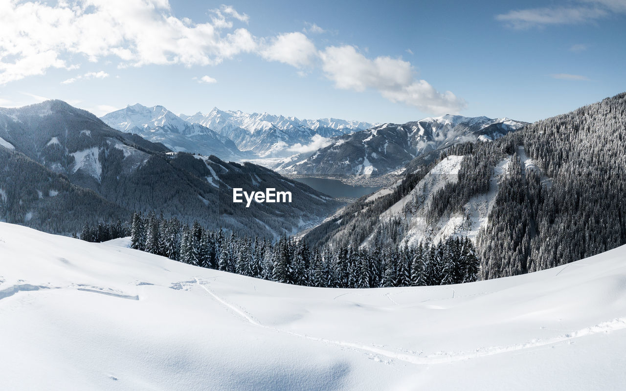 panoramic view of snowcapped mountains against sky