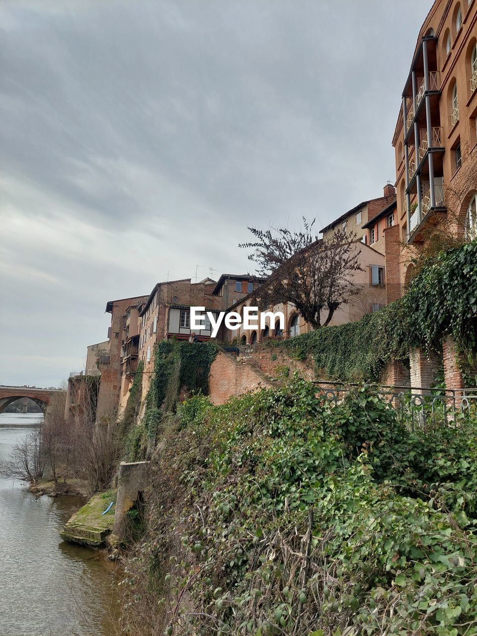 architecture, built structure, building exterior, nature, building, sky, plant, history, cloud, the past, ruins, no people, low angle view, landmark, travel destinations, outdoors, day, tree, travel, house, terrain, religion, tower, wall, environment, tourism, residential district