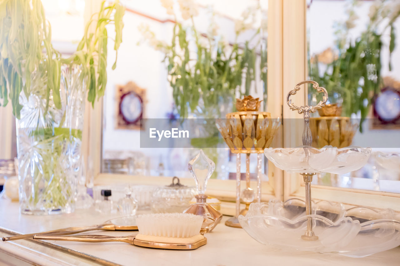 VIEW OF WINE GLASS ON TABLE AT HOME