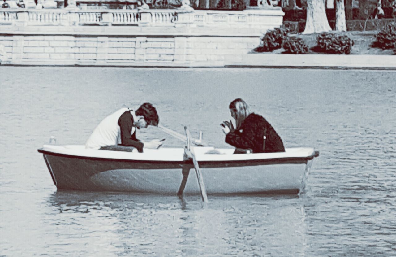 PEOPLE SITTING IN WATER