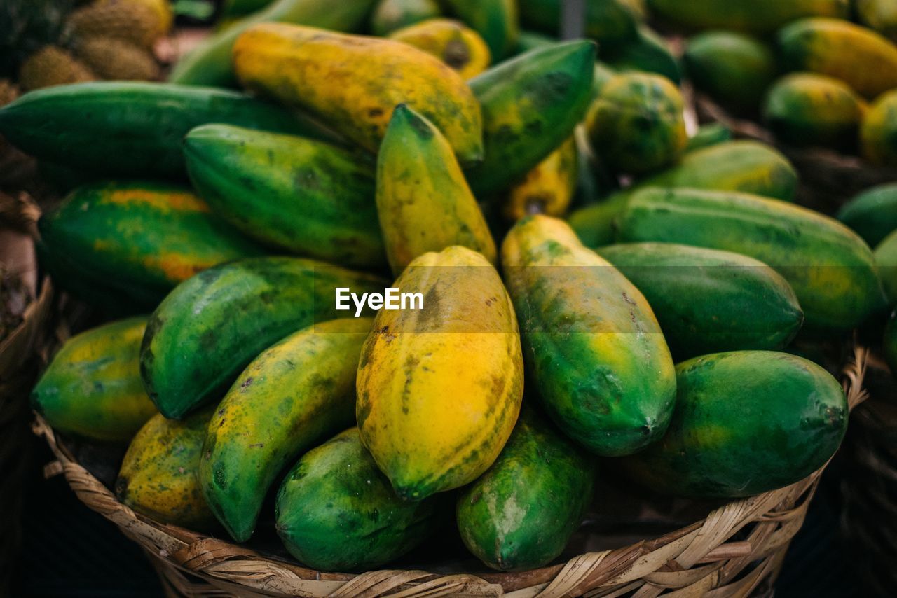 High angle view of fruits in wicker basket for sale at market