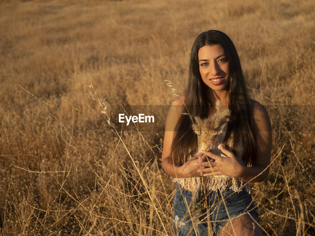 Young woman standing on field