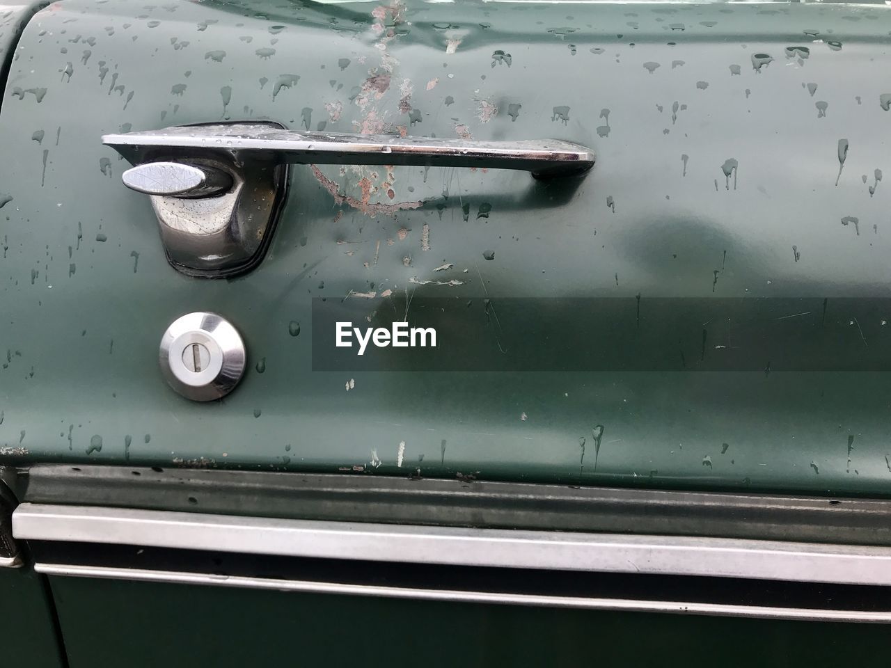 Close-up of wet car door