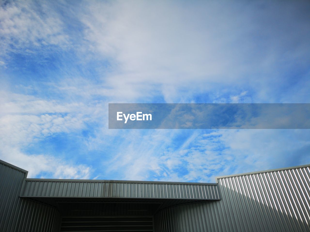 Low angle view of building against blue sky