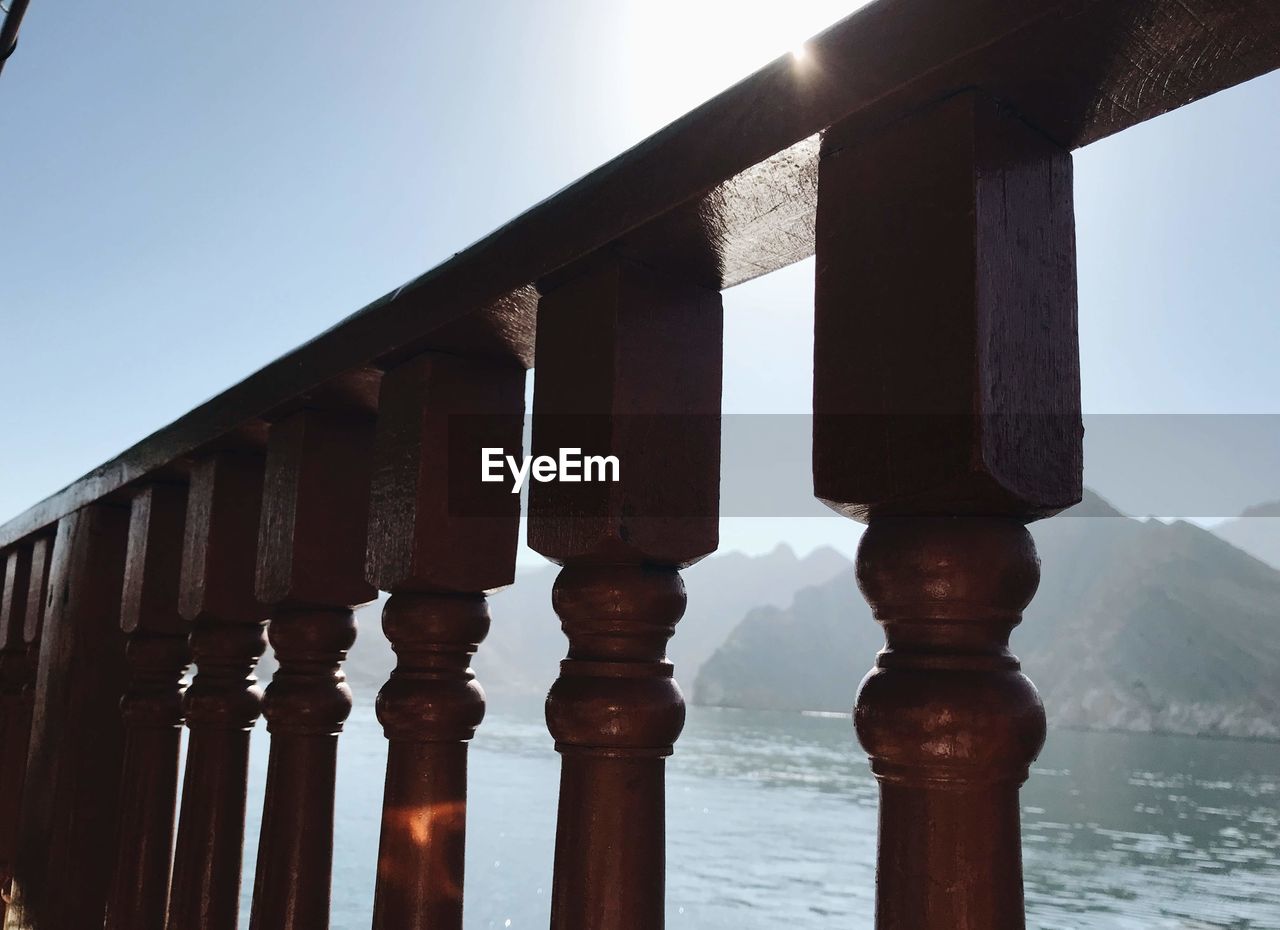 LOW ANGLE VIEW OF METAL STRUCTURE AGAINST SKY