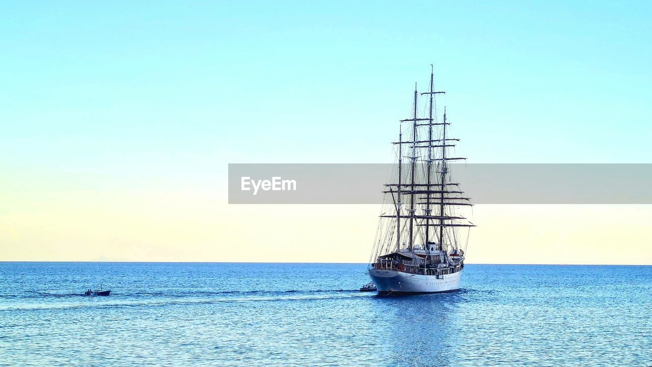 water, sea, sky, horizon, vehicle, horizon over water, tower, nature, mast, transportation, nautical vessel, blue, ocean, no people, scenics - nature, ship, copy space, clear sky, day, beauty in nature, sailing ship, outdoors, sailboat, mode of transportation, tranquility, tranquil scene, sailing, boat, watercraft, bay, sunlight, waterfront