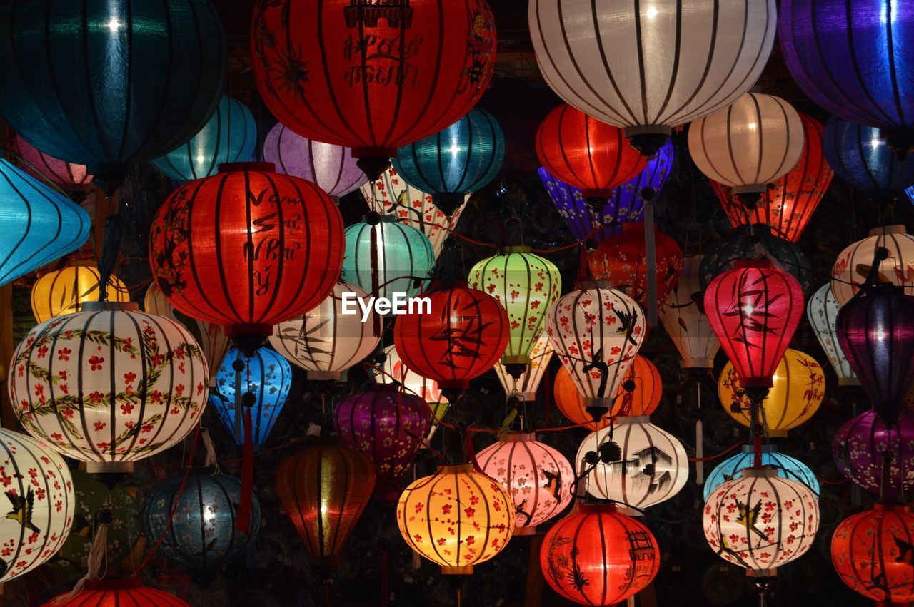 Full frame shot of illuminated lanterns hanging at night