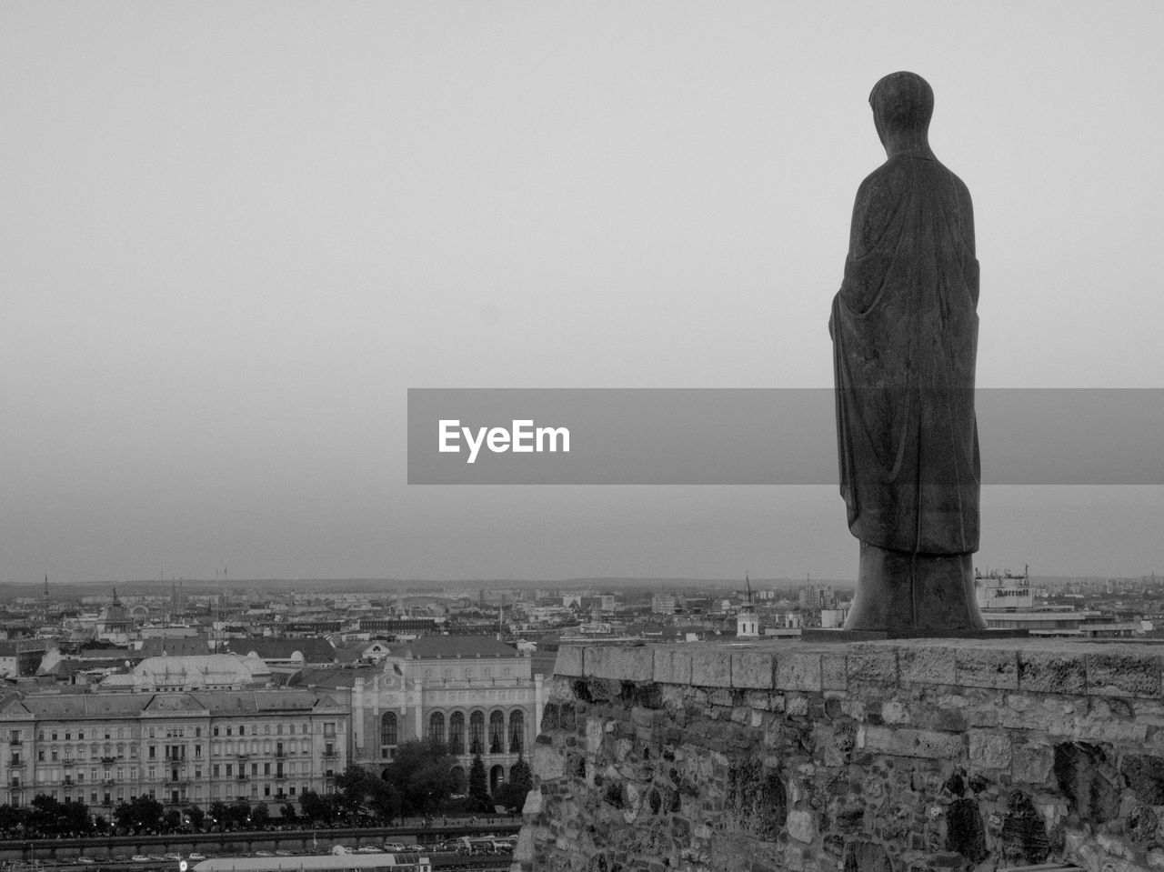 Statue against clear sky in city