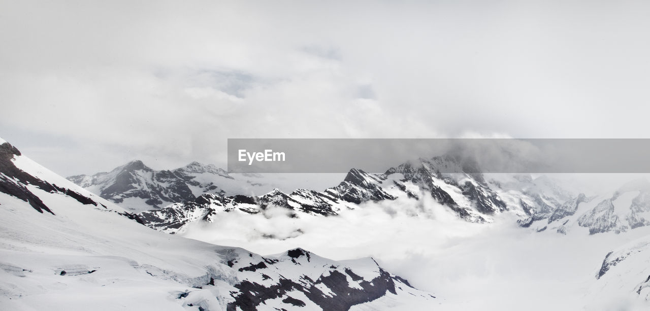 SNOWCAPPED MOUNTAINS AGAINST SKY