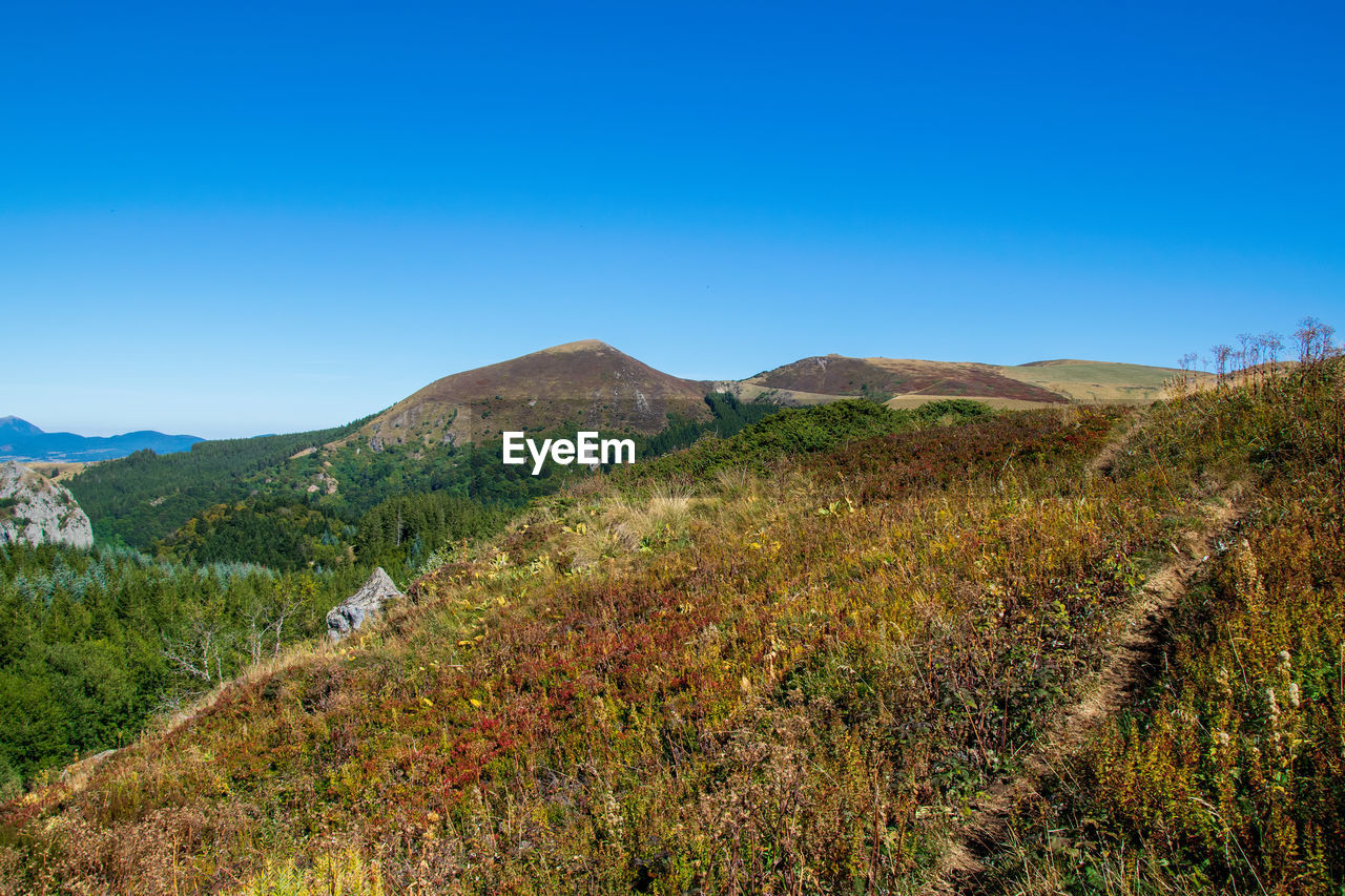 Hiking trail in mountain in auvergne, france