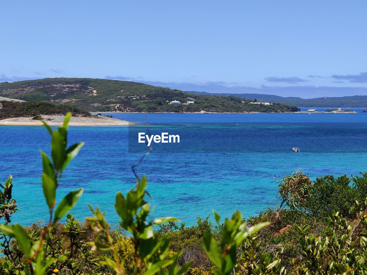 SCENIC VIEW OF BAY AGAINST SKY