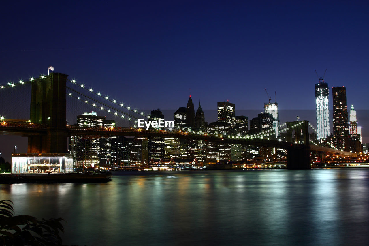 River with illuminated buildings in distance