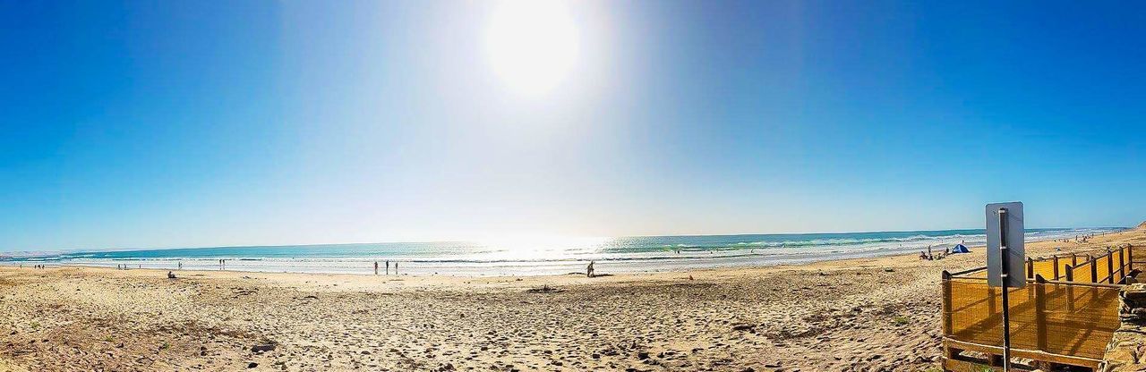 SCENIC VIEW OF BEACH AGAINST CLEAR BLUE SKY