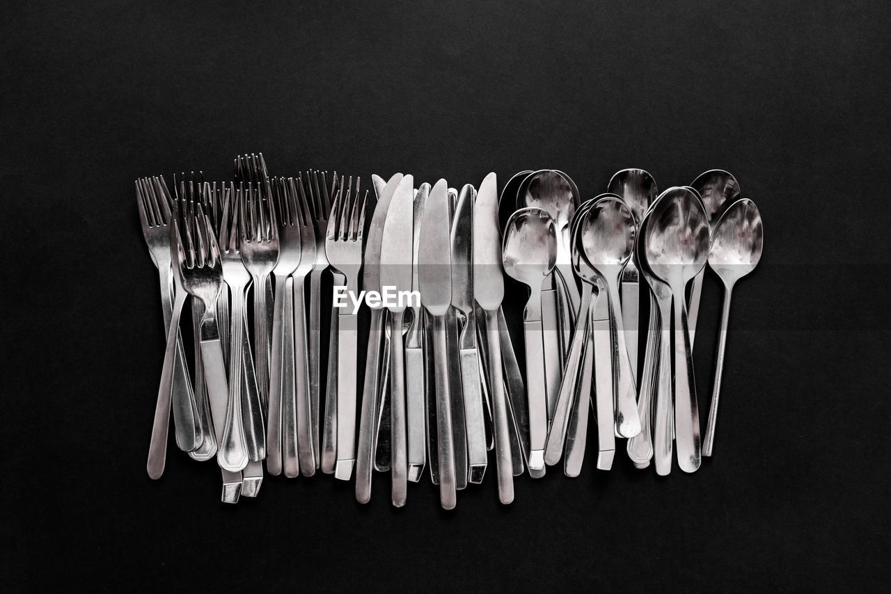 Directly above shot of cutlery black background