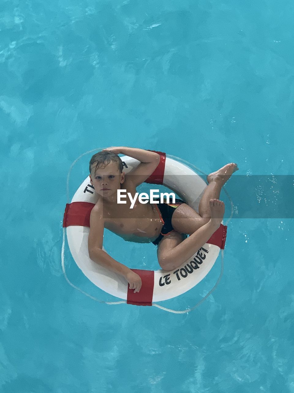 High angle view of boy in swimming pool