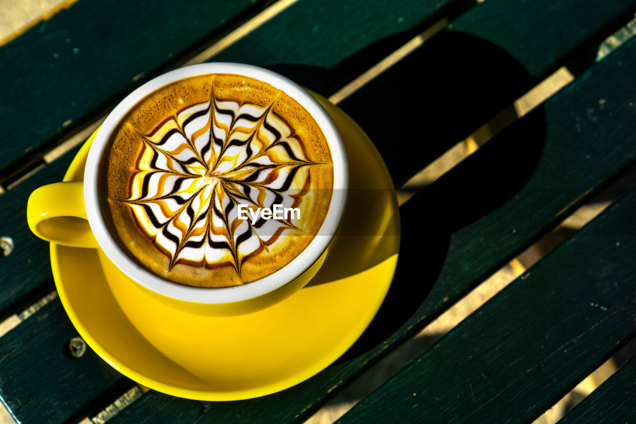 High angle view of coffee cup on table