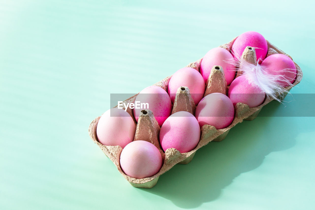 Minimal easter concept. easter elements, paper box with eggs in pink colors