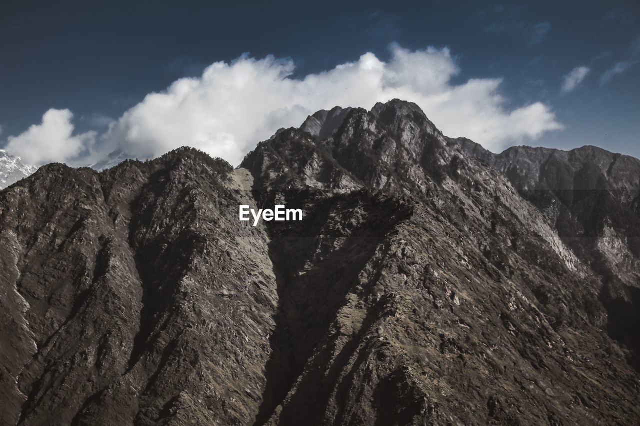 Low angle view of rock formation against sky