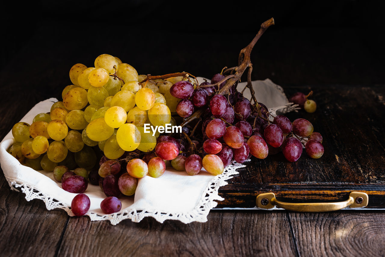 Close-up of grapes on table