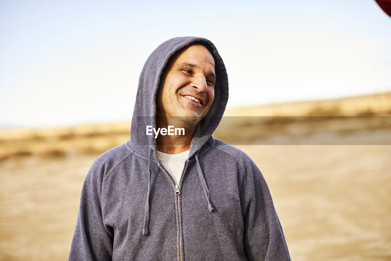 An outdoor portrait of a middle aged man.