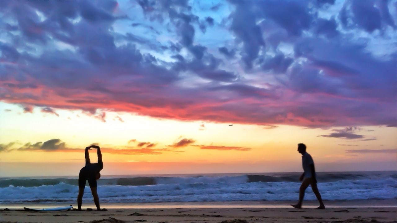 People exercising on beach