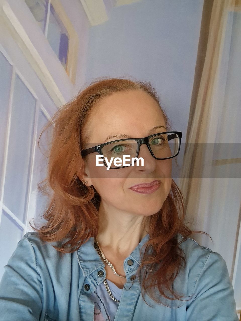 glasses, women, adult, lying down, one person, human hair, indoors, blond hair, young adult, human face, relaxation, portrait, eyeglasses, skin, lifestyles, smiling, person, hairstyle, headshot, human head, domestic room, high angle view, long hair, happiness, female, vision care, leisure activity, technology, human mouth, home interior, furniture, lying on back, casual clothing, clothing, emotion, human eye, bed, brown hair, hand