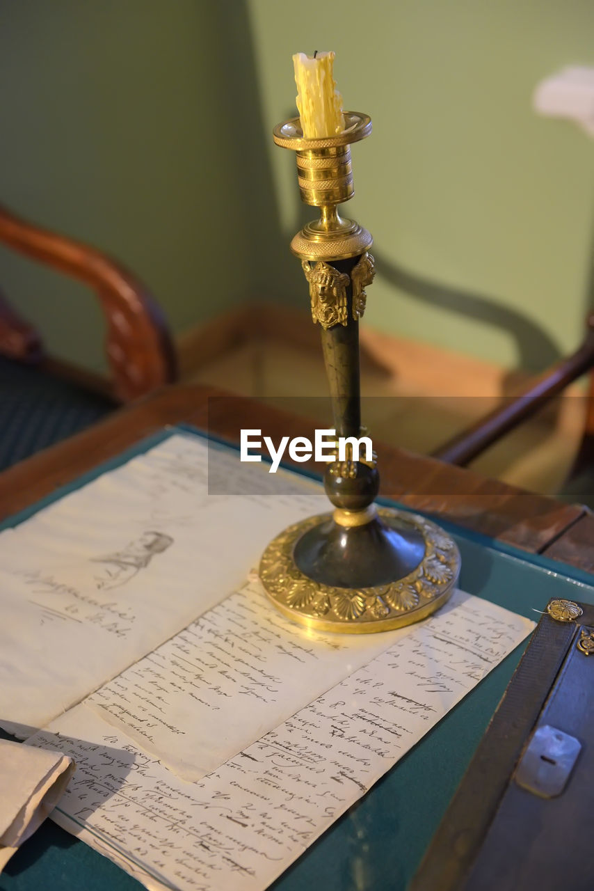 CLOSE-UP OF BOOK ON TABLE