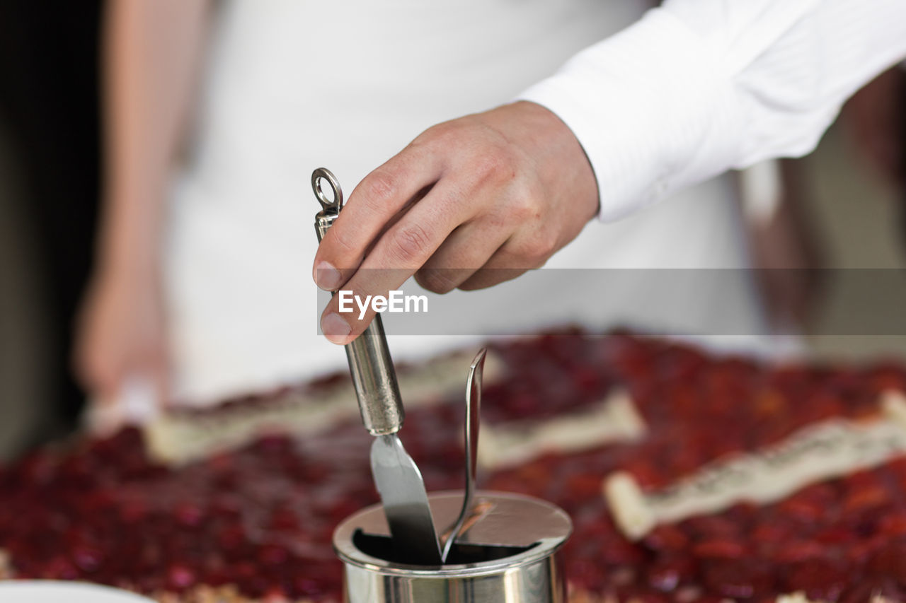 Close-up of man preparing food