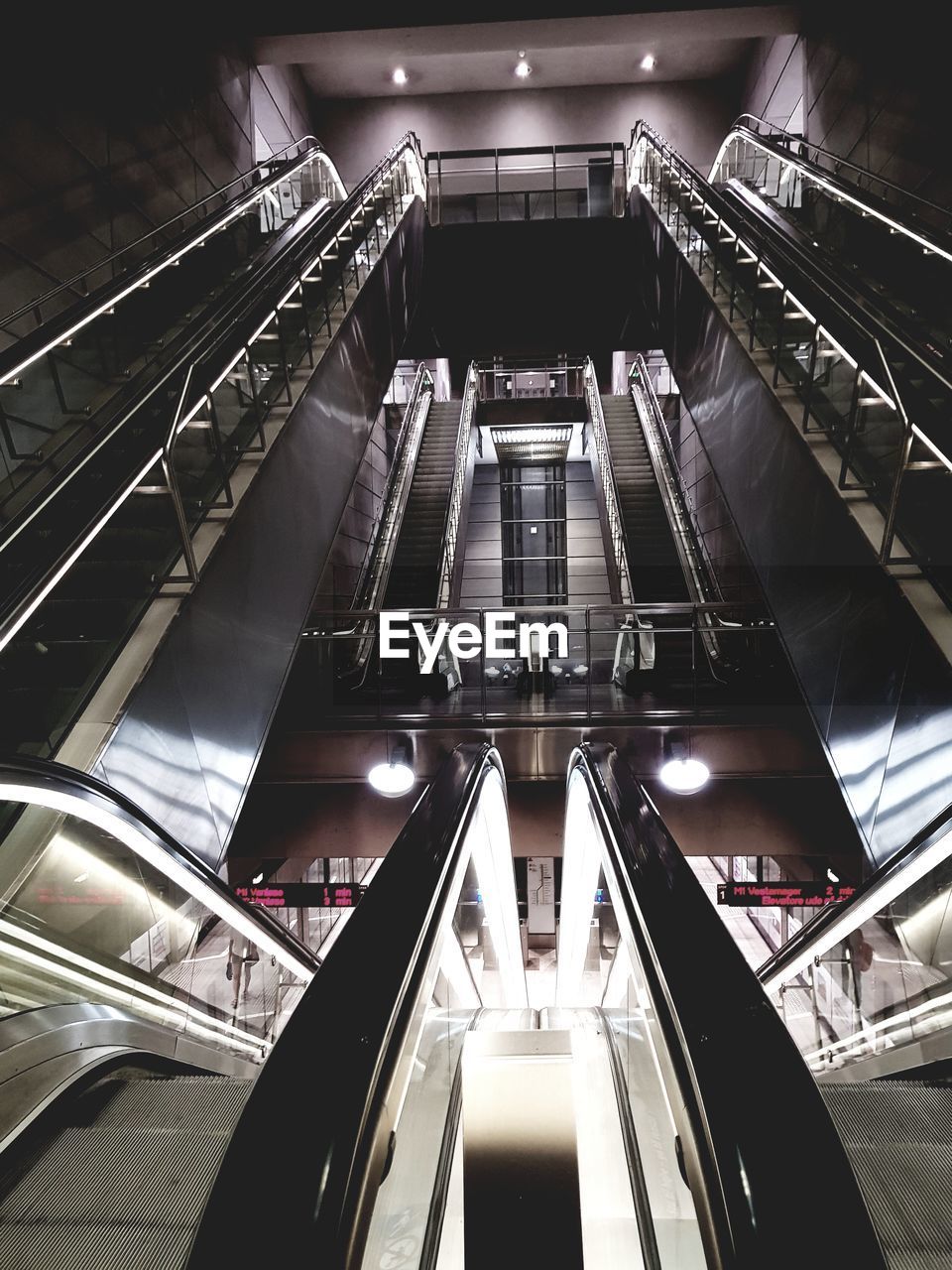 LOW ANGLE VIEW OF ESCALATOR IN SUBWAY STATION