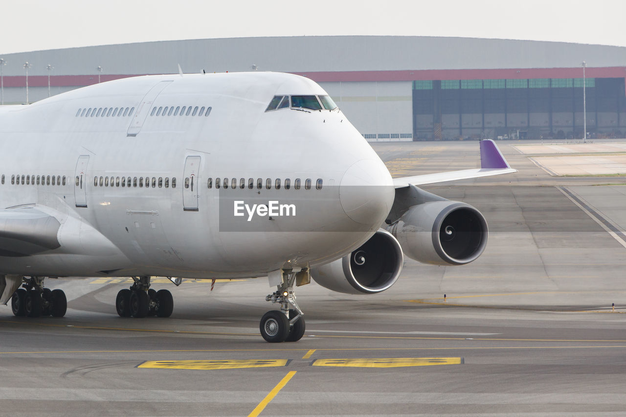 View of airplane at airport runway