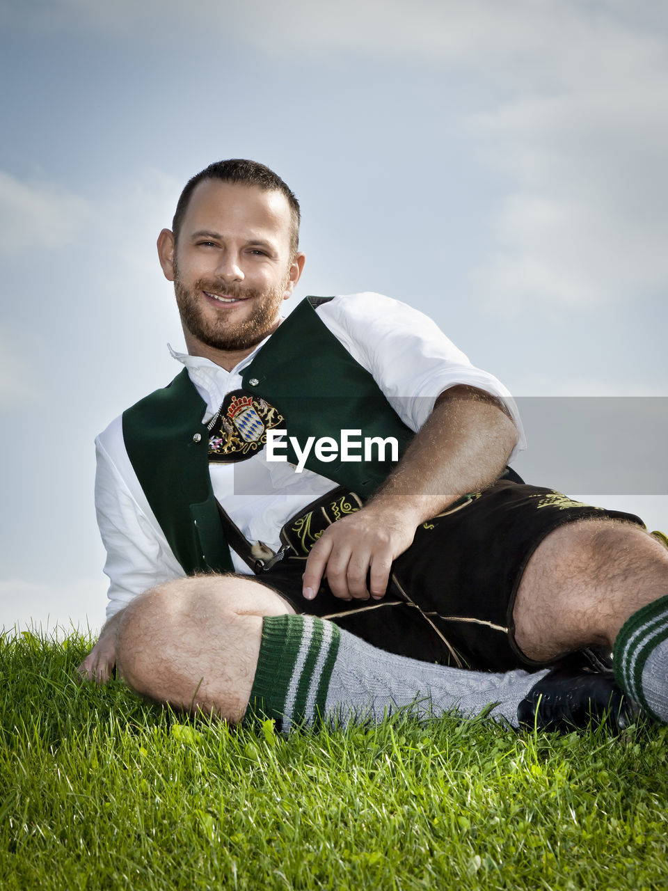 Portrait of man on field against sky