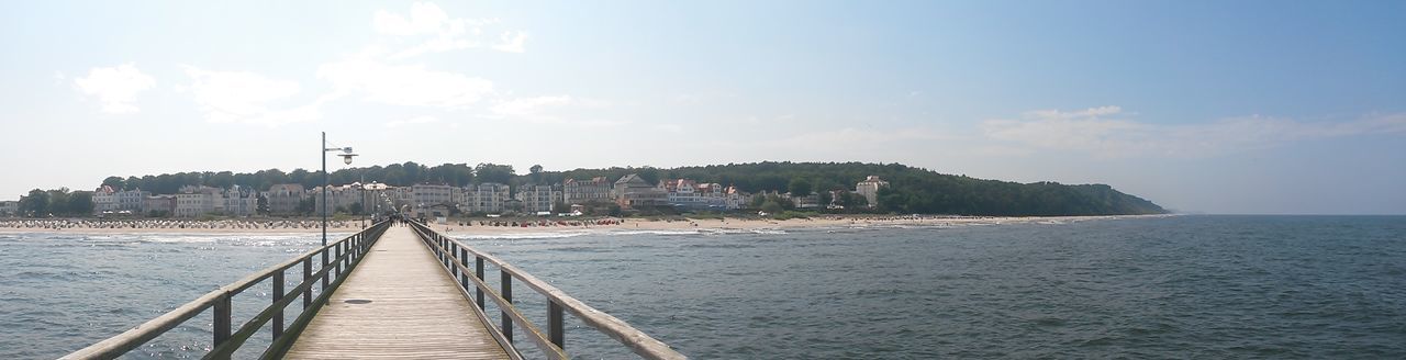 VIEW OF TOWN WITH SEA IN BACKGROUND