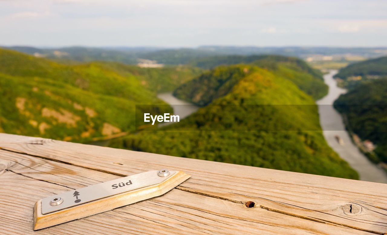 High angle view of table on landscape against sky