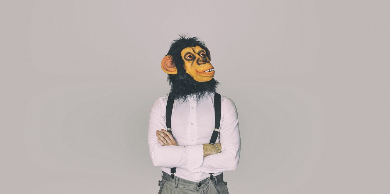 Man wearing mask against white background