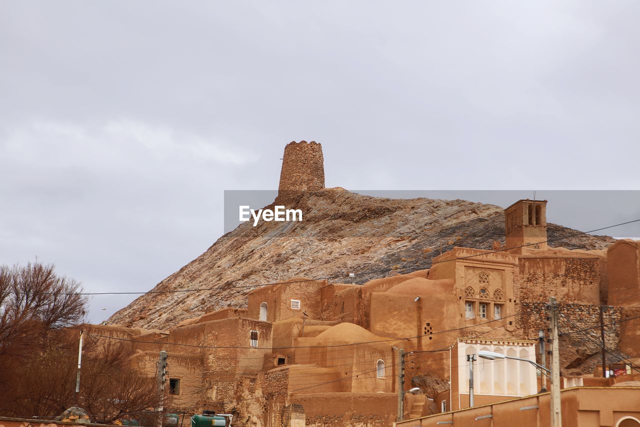 Low angle view of old building against sky anarak history iran