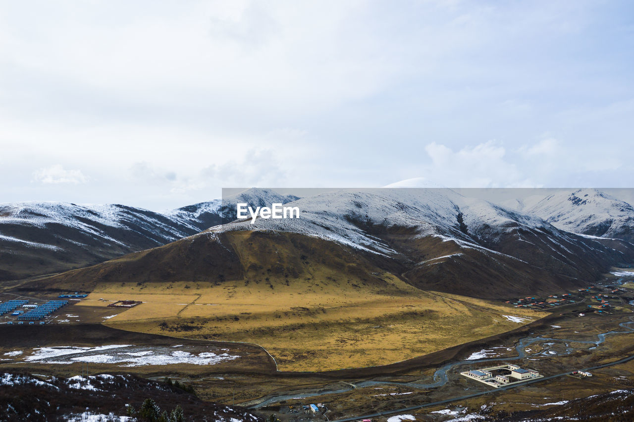 Scenic view of mountains against sky during winter