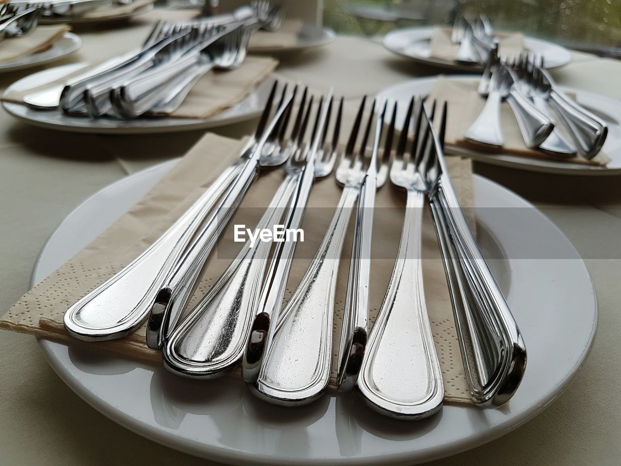 Close-up of fork in plate on table