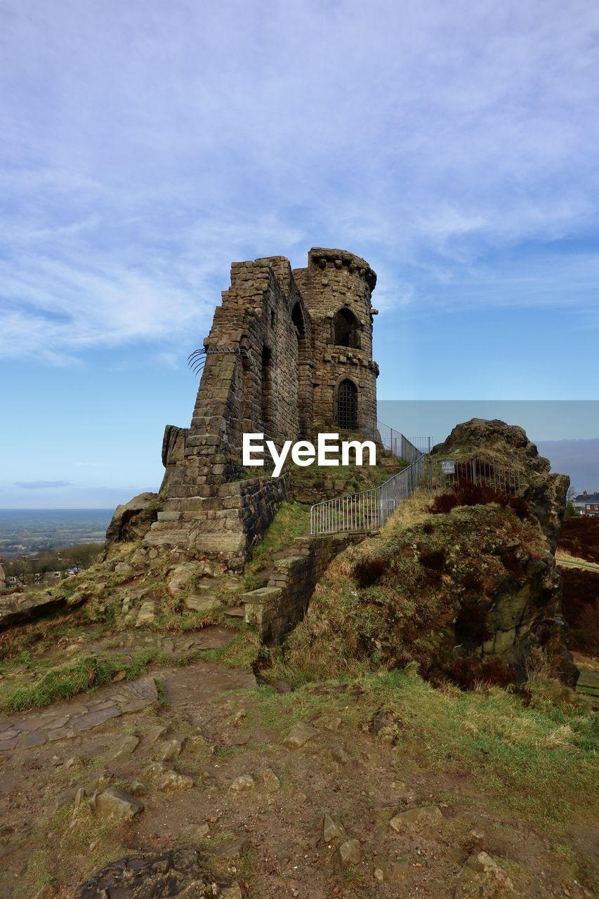 Low angle view of old ruin building against sky