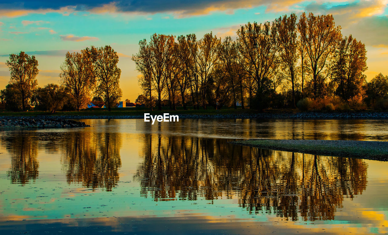 Scenic view of lake against sky during sunset