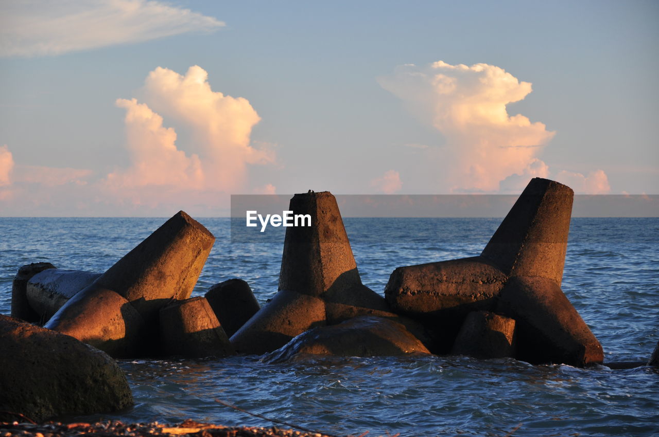 Scenic view of sea against cloudy sky