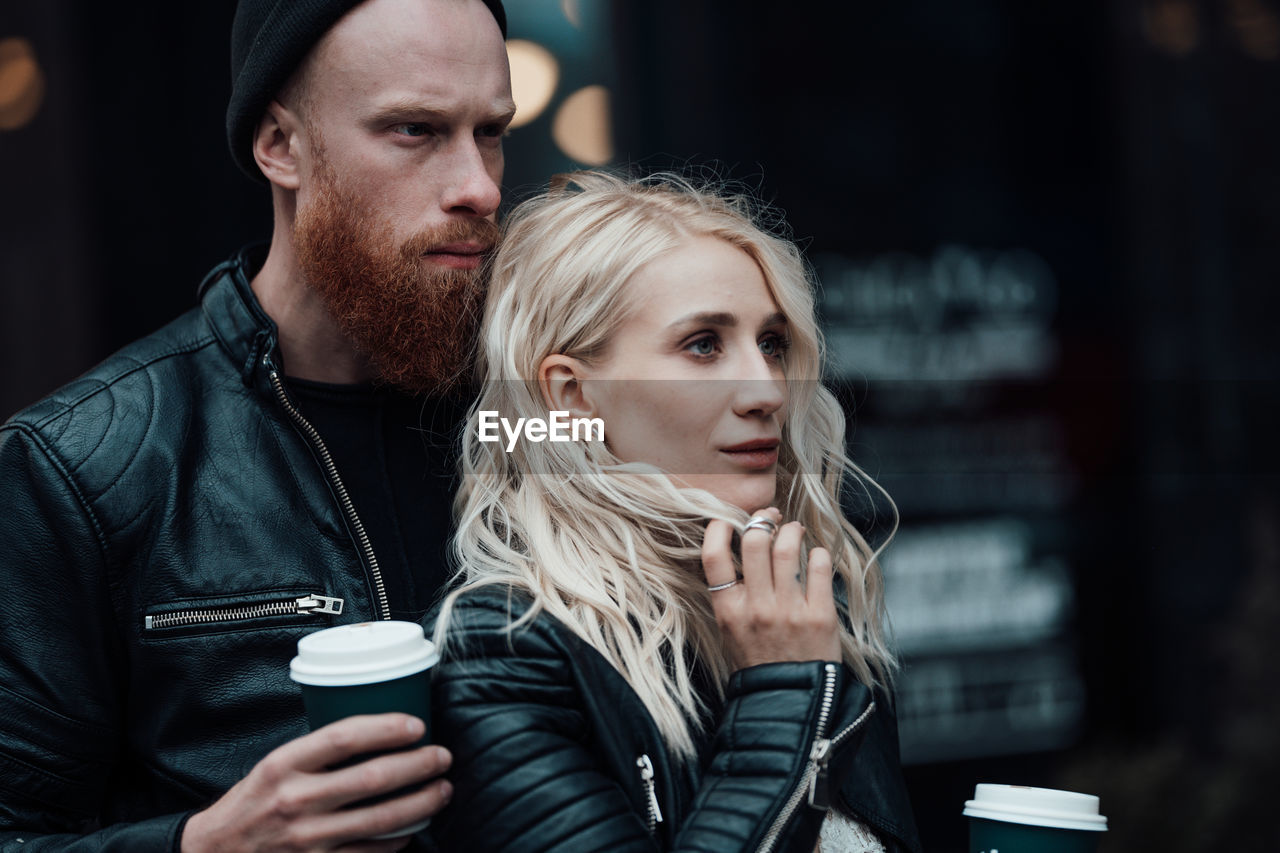 Young couple looking at camera